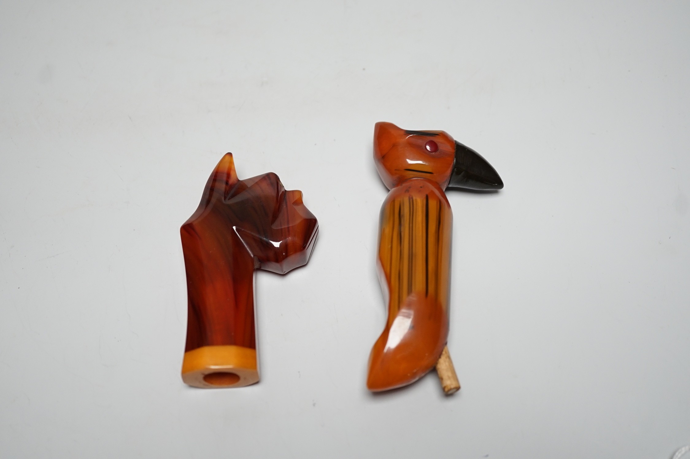 Two butterscotch amber phenolic Bakelite umbrella handles